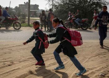 Palestinian school children are seen after Israel carried out airstrikes