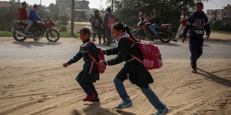 Palestinian school children are seen after Israel carried out airstrikes
