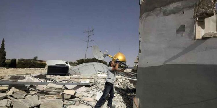 IOF Forces a Palestinian Family to Demolish 3 Houses in Silwan