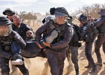 Israeli police detain a man as Bedouins